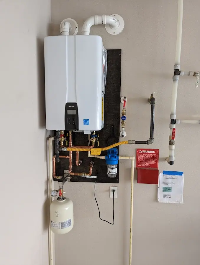 Professional plumber installing copper piping in a Cimarron Hills home